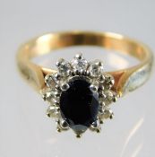 An 9ct gold diamond & sapphire ring 3.6g size L/M