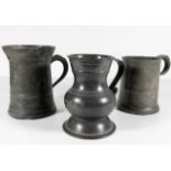 Three pewter tankards including a pot belly