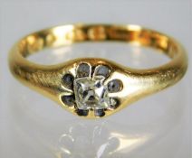 An antique 18ct gold ring set with cushion shaped
