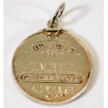 A silver Clayworks medal awarded for long service