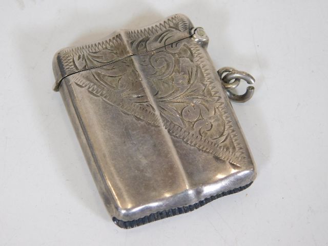 A silver vesta case