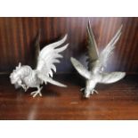 Two metal cockerel figures