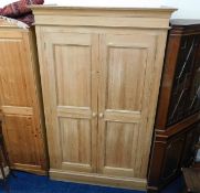 A good quality modern solid pine wardrobe