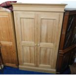 A good quality modern solid pine wardrobe