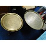 Two brass Benares tables with stands