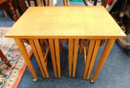 A teak nest of five tables