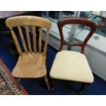 A c.1900 elm farmhouse chair twinned with an uphol