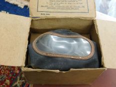 A WW2 gas mask with box