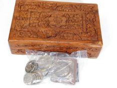 A carved wooden box with coin contents inc. Victor