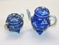 A Chinese teapot with prunus decor twinned with a