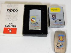 Two Zippo lighters & a money clip all bearing USS