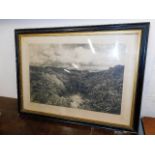 A framed antique landscape print