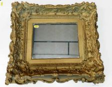 An antique gilt framed mirror