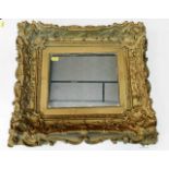 An antique gilt framed mirror