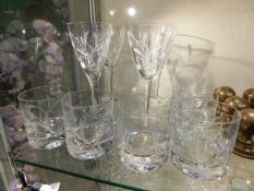 Four large Edinburgh crystal wine glasses with whe