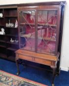 A mahogany glazed display cabinet & later a matched ball & claw foot stand, as found with faults