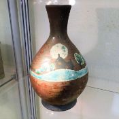 A West Country studio pottery vase with enamelled