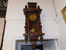 A German mahogany wall clock