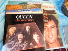A quantity of vinyl LP's including Beatles, Queen,