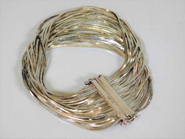 A heavy gauge silver bracelet approx. 56g