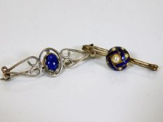 A silver brooch with lapis lazuli stone twinned wi