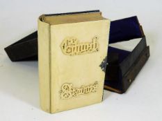 A leather cased 19thC. bible with ivory covers