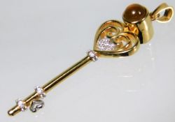 An 18ct gold key pendant set with citrine main sto