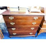 A mahogany chest of drawers with brass fittings