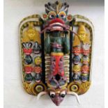 A large 20thC. wall mounted Thai carving featuring