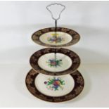 A vintage three tier Midwinter cake stand