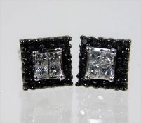 A pair of 10ct gold black & white diamond earrings