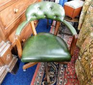 A green leather office chair
