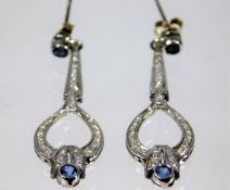 A pair of 9ct gold diamond & sapphire drop earring