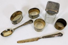 Four silver napkin rings, a silver spoon & other i