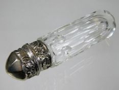 A cut glass scent bottle with decorative white met