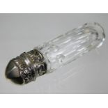 A cut glass scent bottle with decorative white met