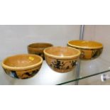 Four ethnic earthenware bowls with naive decor
