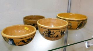 Four ethnic earthenware bowls with naive decor