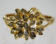 An 18ct gold diamond cocktail ring of organic form with diamonds set within leaves size S/T 4.2g