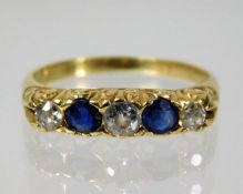 An 18ct gold diamond & sapphire ring size M/N 2.8g