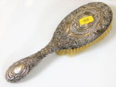 A silver backed clothes brush