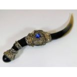 An Indian horn dagger with white metal fittings, t