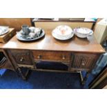 An oak lowboy with two cupboards & drawer