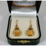 A pair of 14ct gold earrings with pure gold nugget