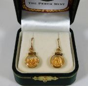 A pair of 14ct gold earrings with pure gold nugget