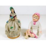 A continental porcelain doll figure twinned with o