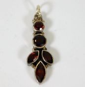 A silver mounted garnet pendant