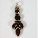 A silver mounted garnet pendant