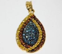 A 9ct gold pendant set with lemon, cinnamon & blue