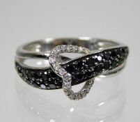 A 14ct white gold ring with interlocked heart set